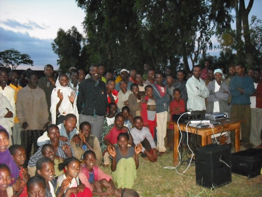 The curious crowd begins to gather in preparation for the Jesus Film